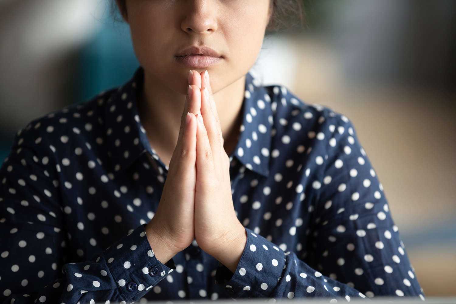 s woman in calm and meditative prayer
