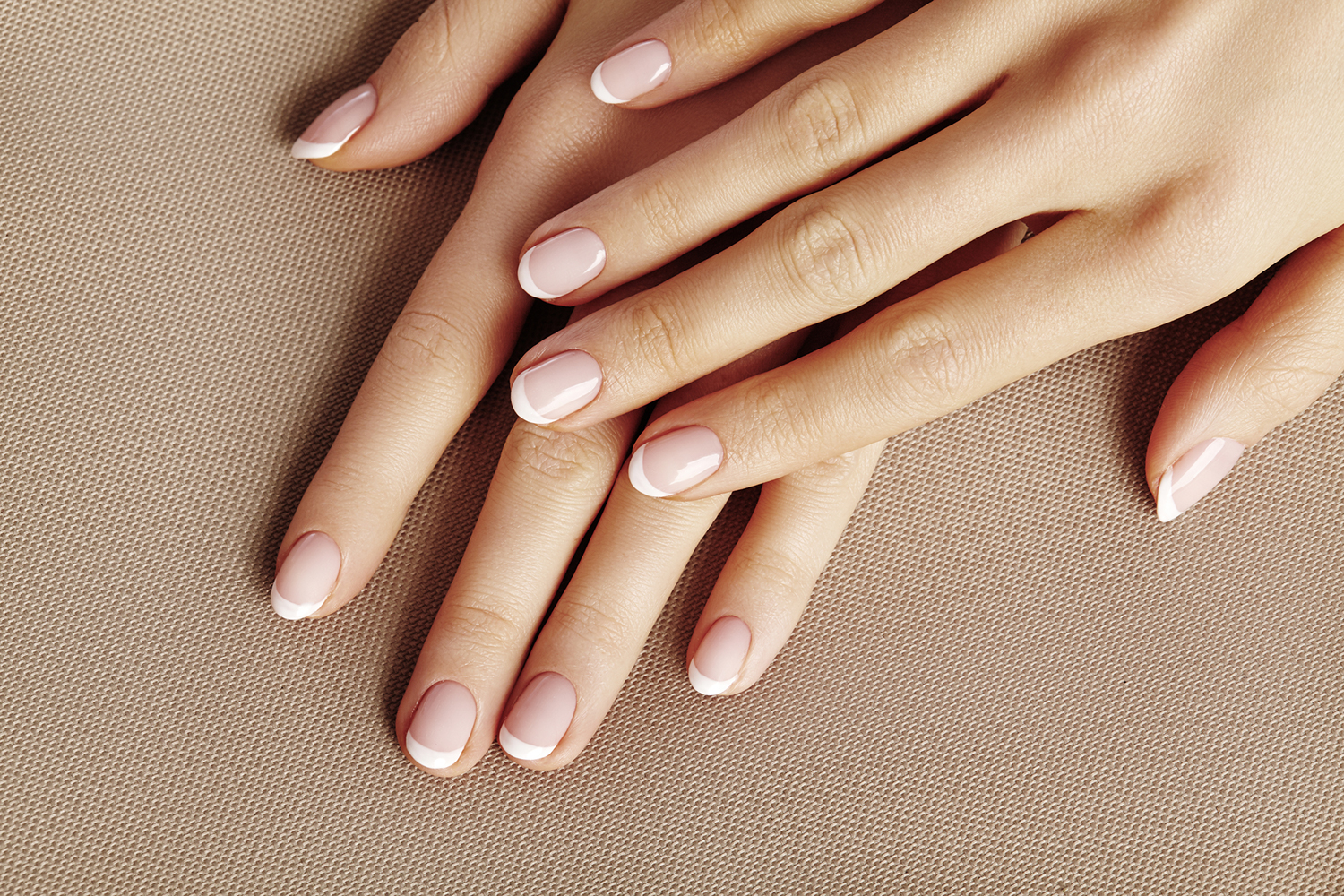 A woman's hands with well groomed healthy nails.