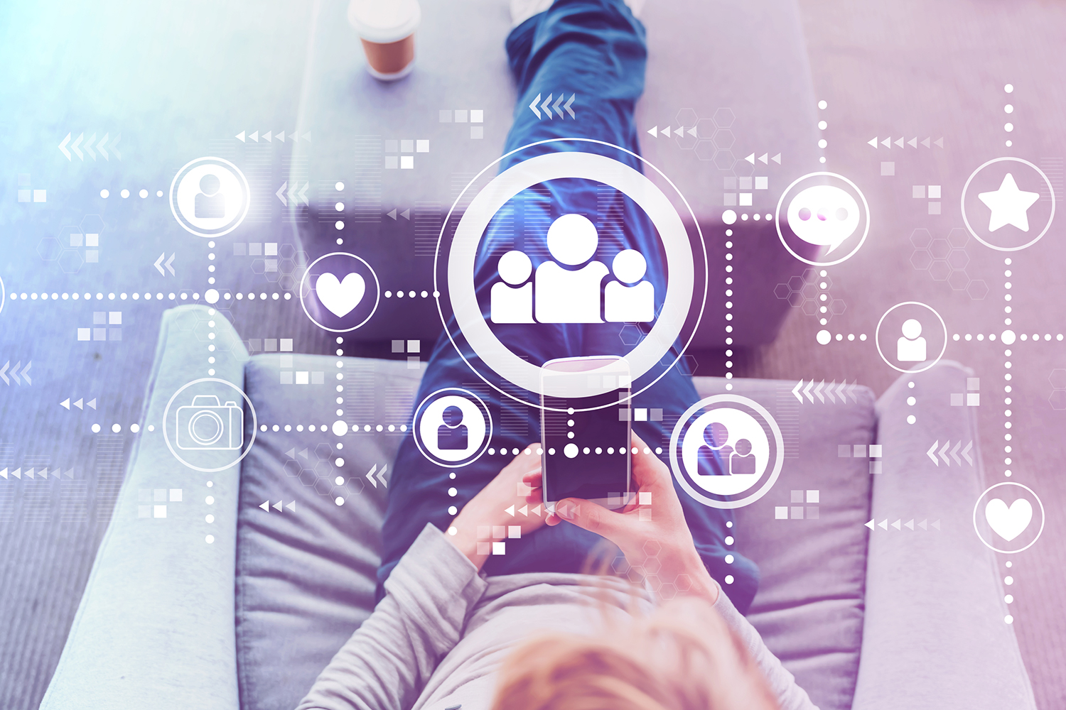 Man using a cell phone with social media icons illustrated above it.