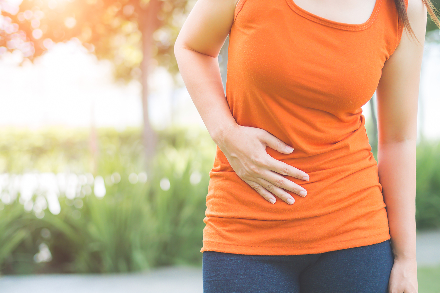 a woman breathing through pain in her abdomen