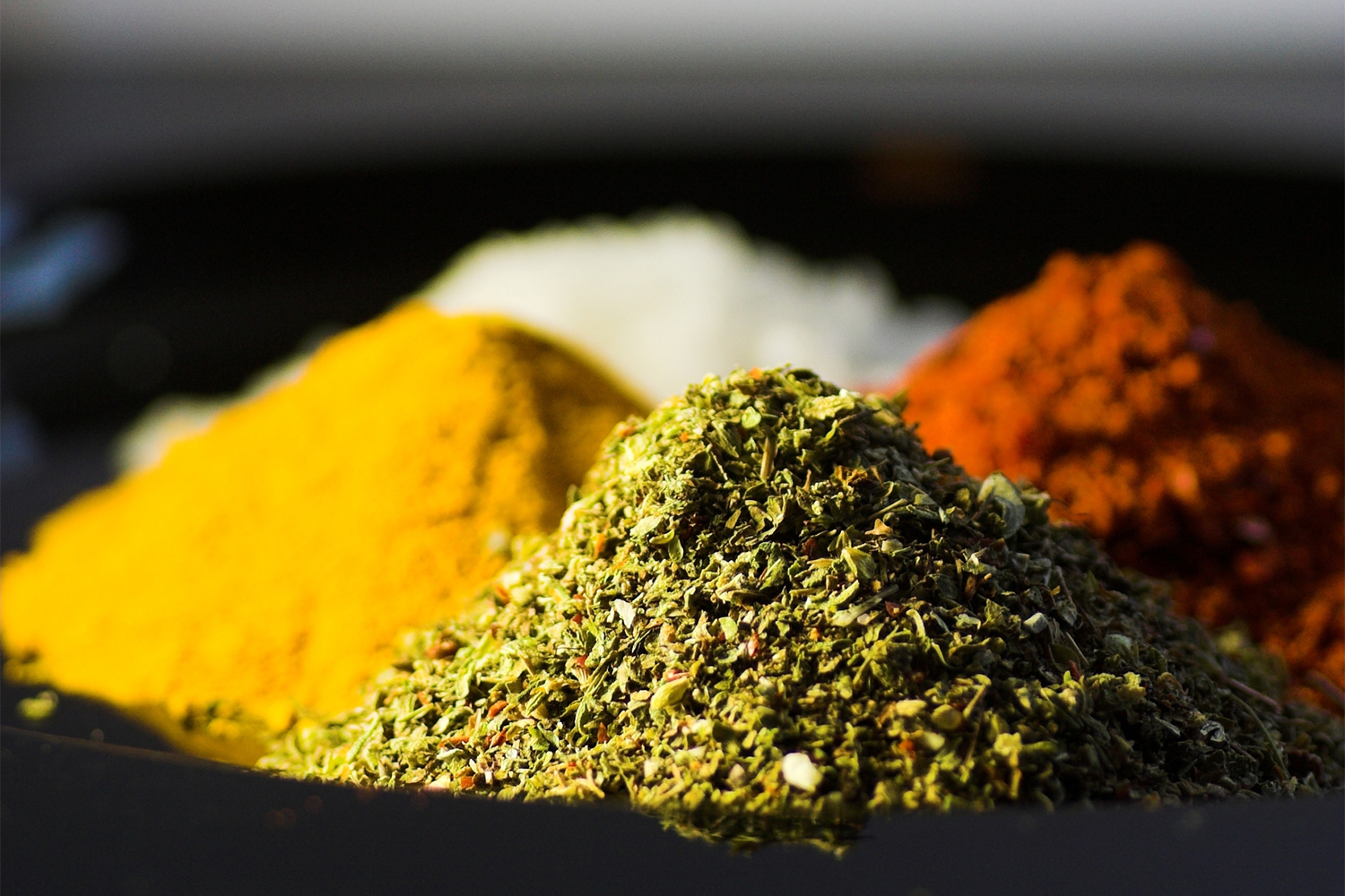 piles of fresh herbs used in ayurveda