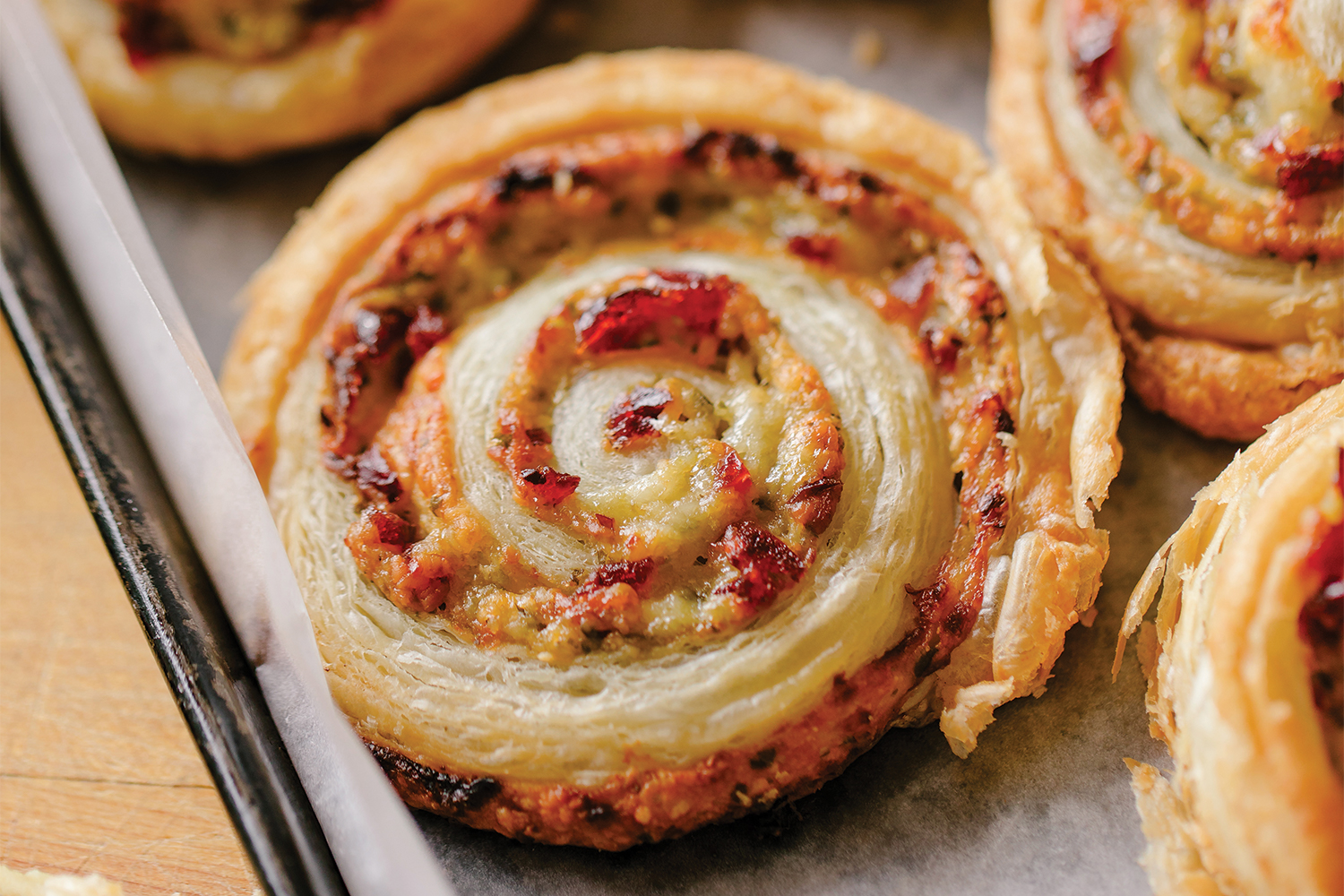 A pinwheel pastry on a baking sheet