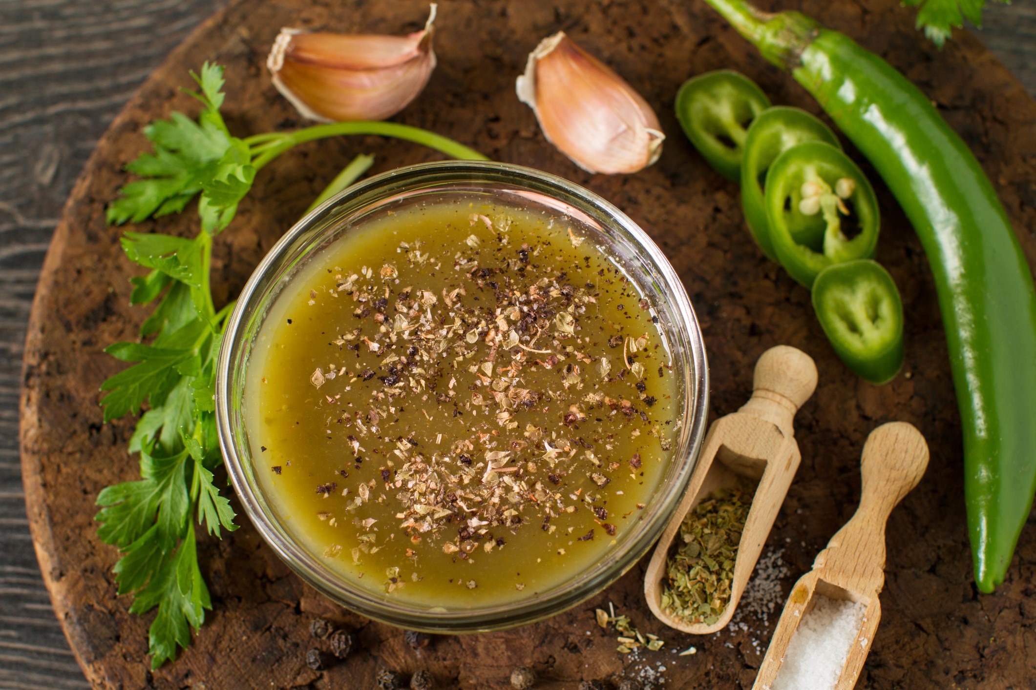 Magic Green sauce in a small glass bowl surrounded by ingredients.