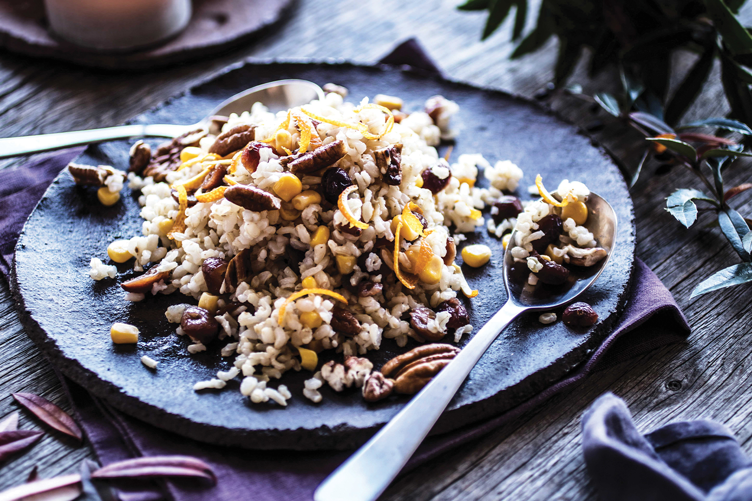 Thanksgiving Rice on a blue rustic plate with a blue toned background.
