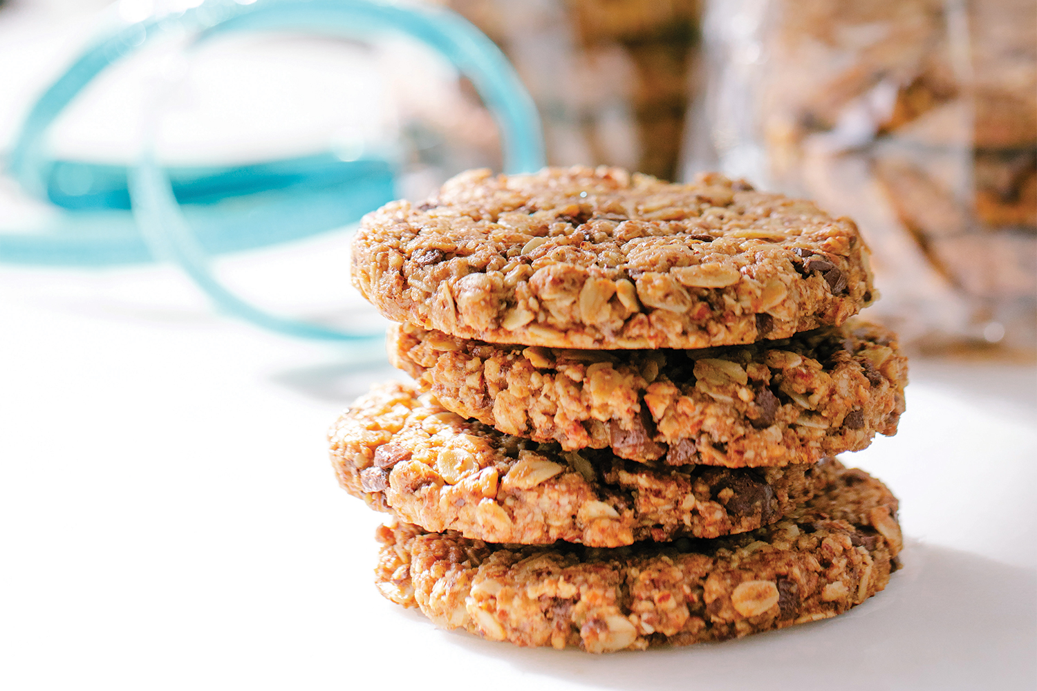 A stack of granola cookies with chocolate and nuts