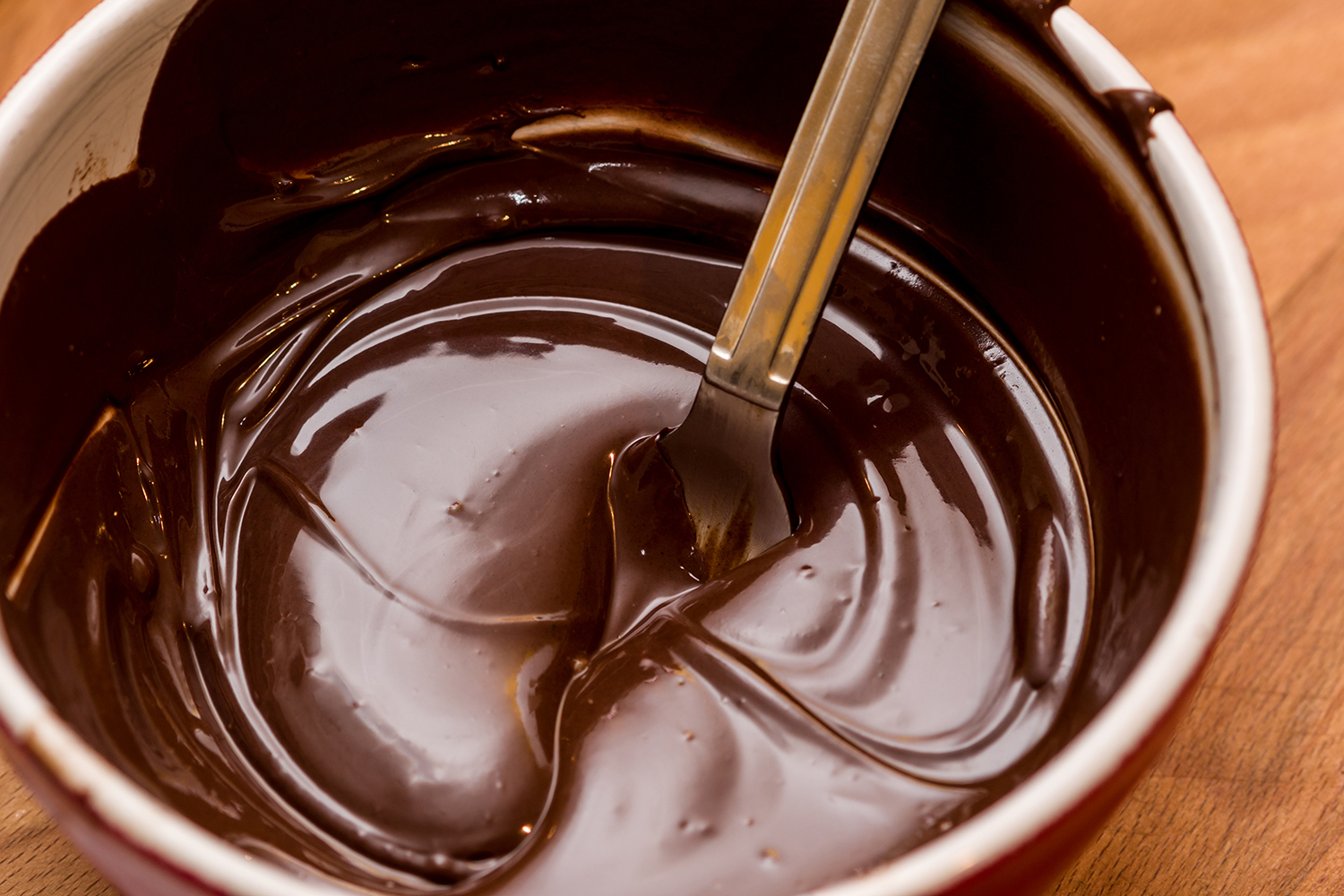 A bowl of melted chocolate.