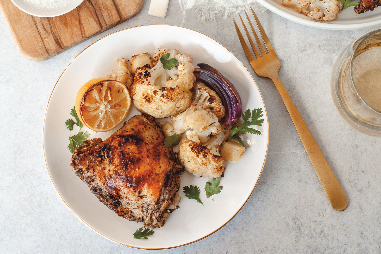 spicy chicken plated with lemon and onion