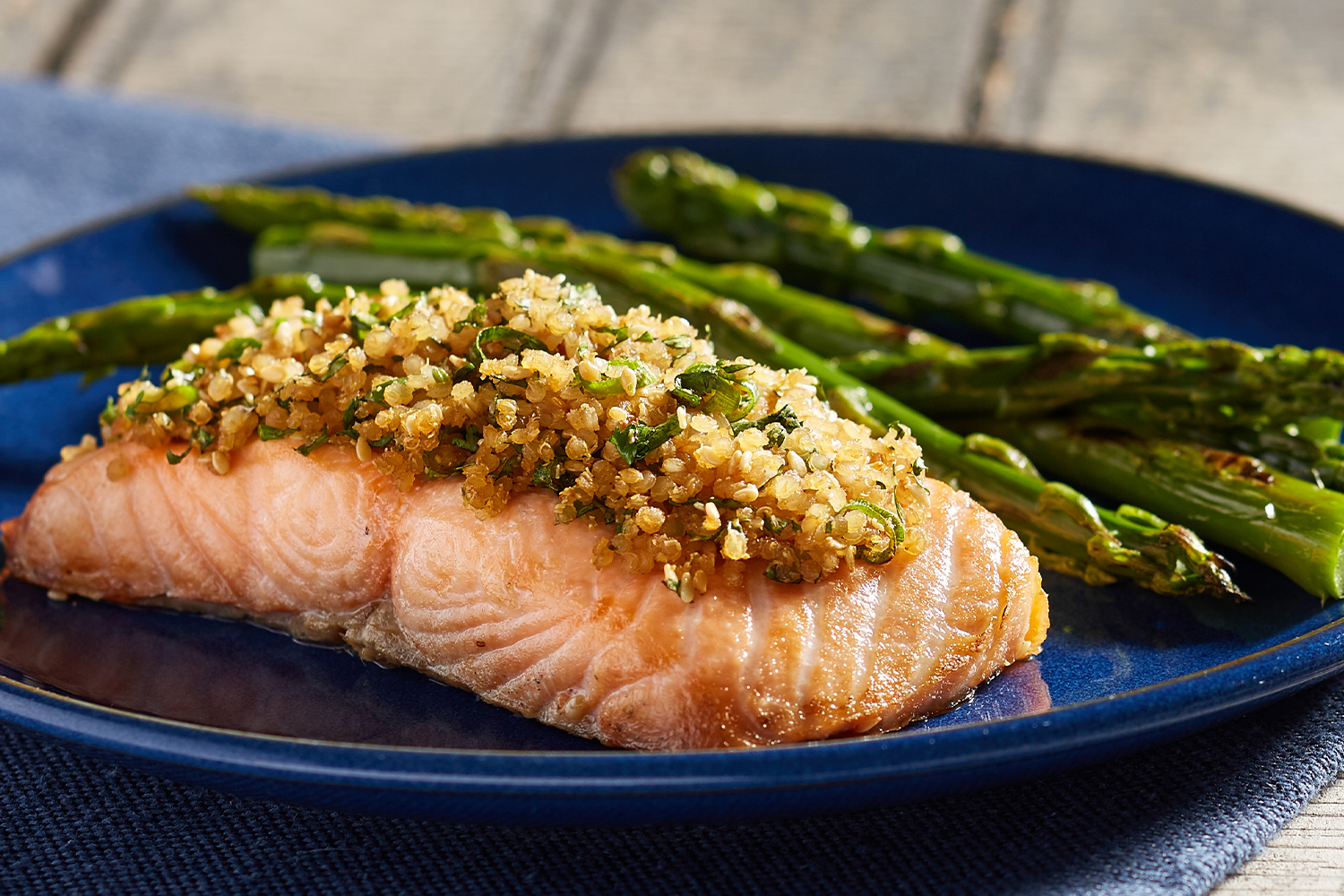 A plate of salmon crusted with quinoa