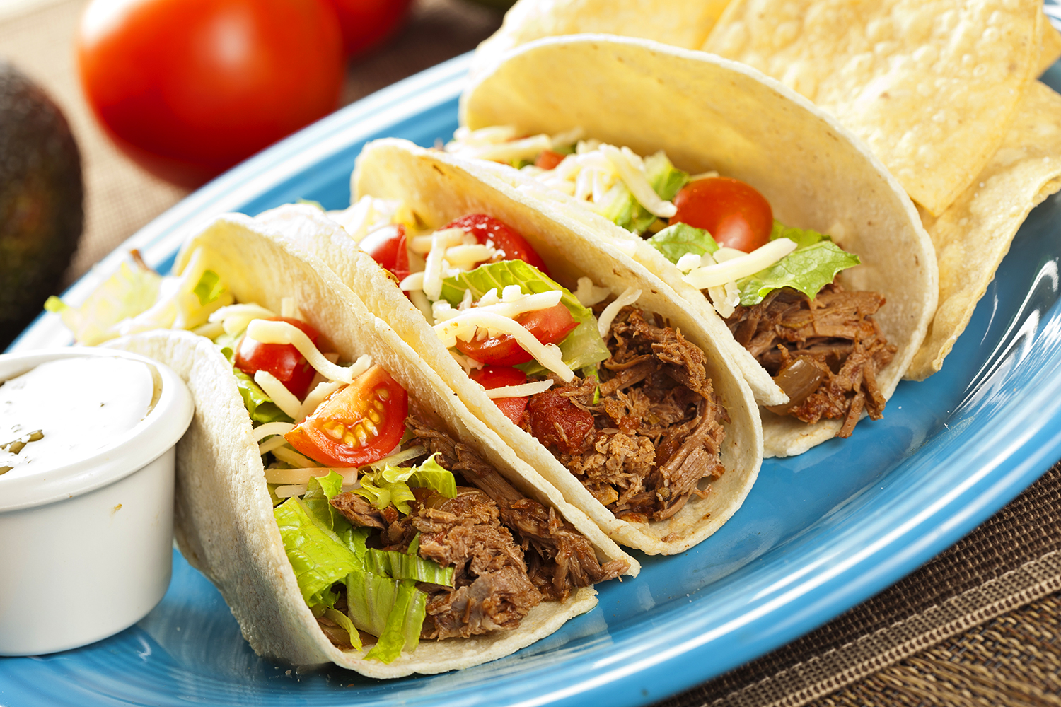 A plate of shredded beef tacos