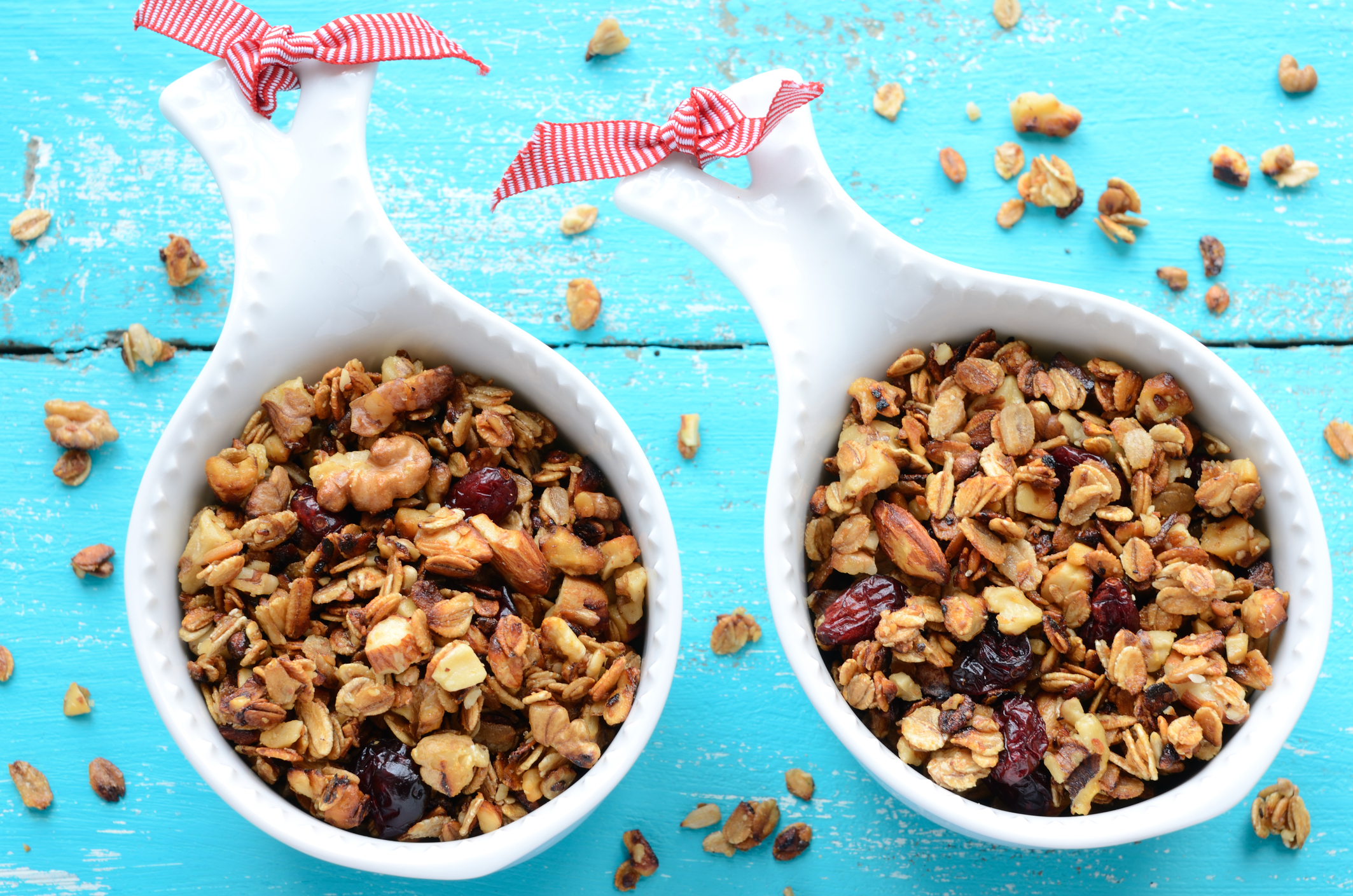 Two cups filled with granola. 