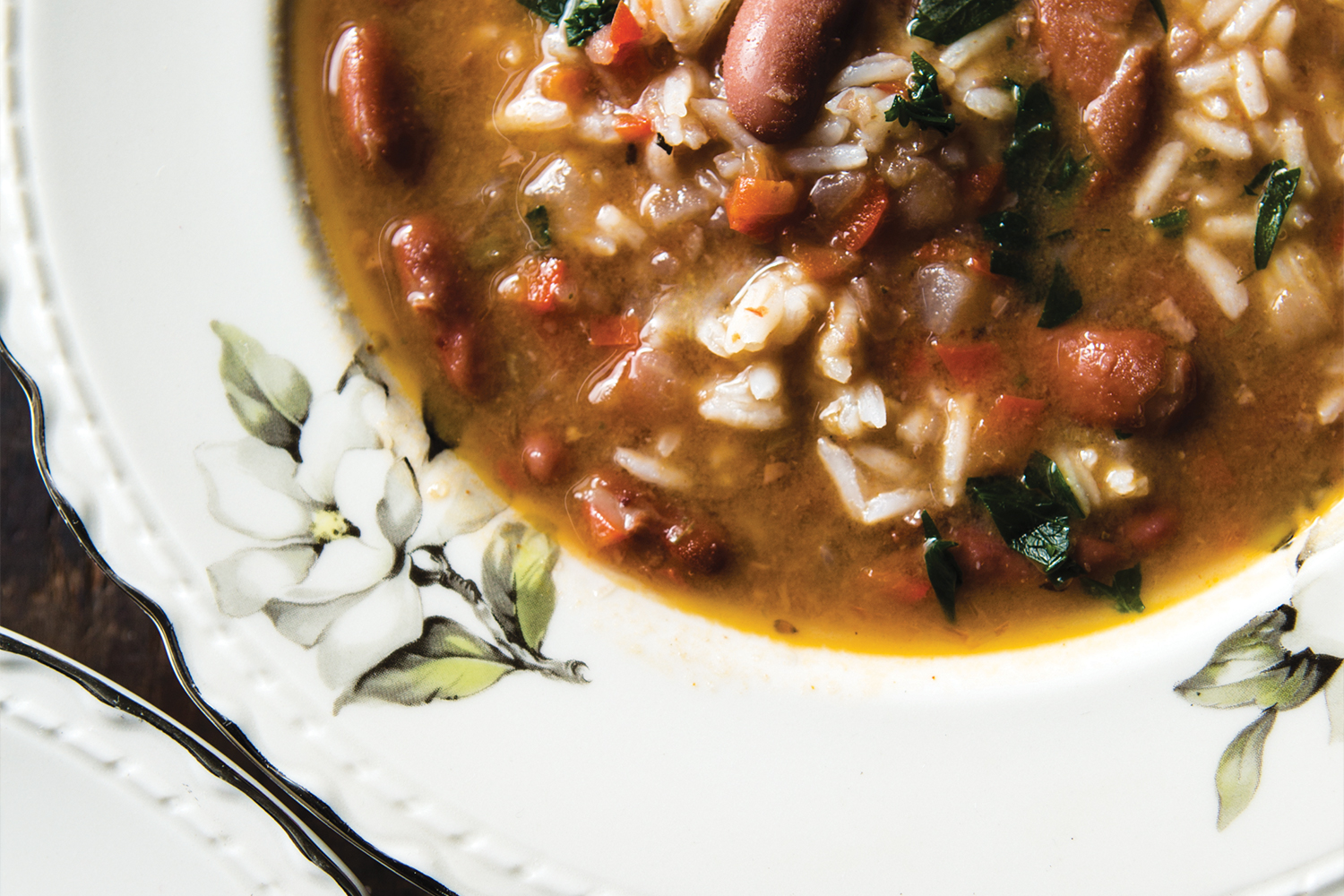 Red Beans and Rice Soup in a white bowl with floral accents.