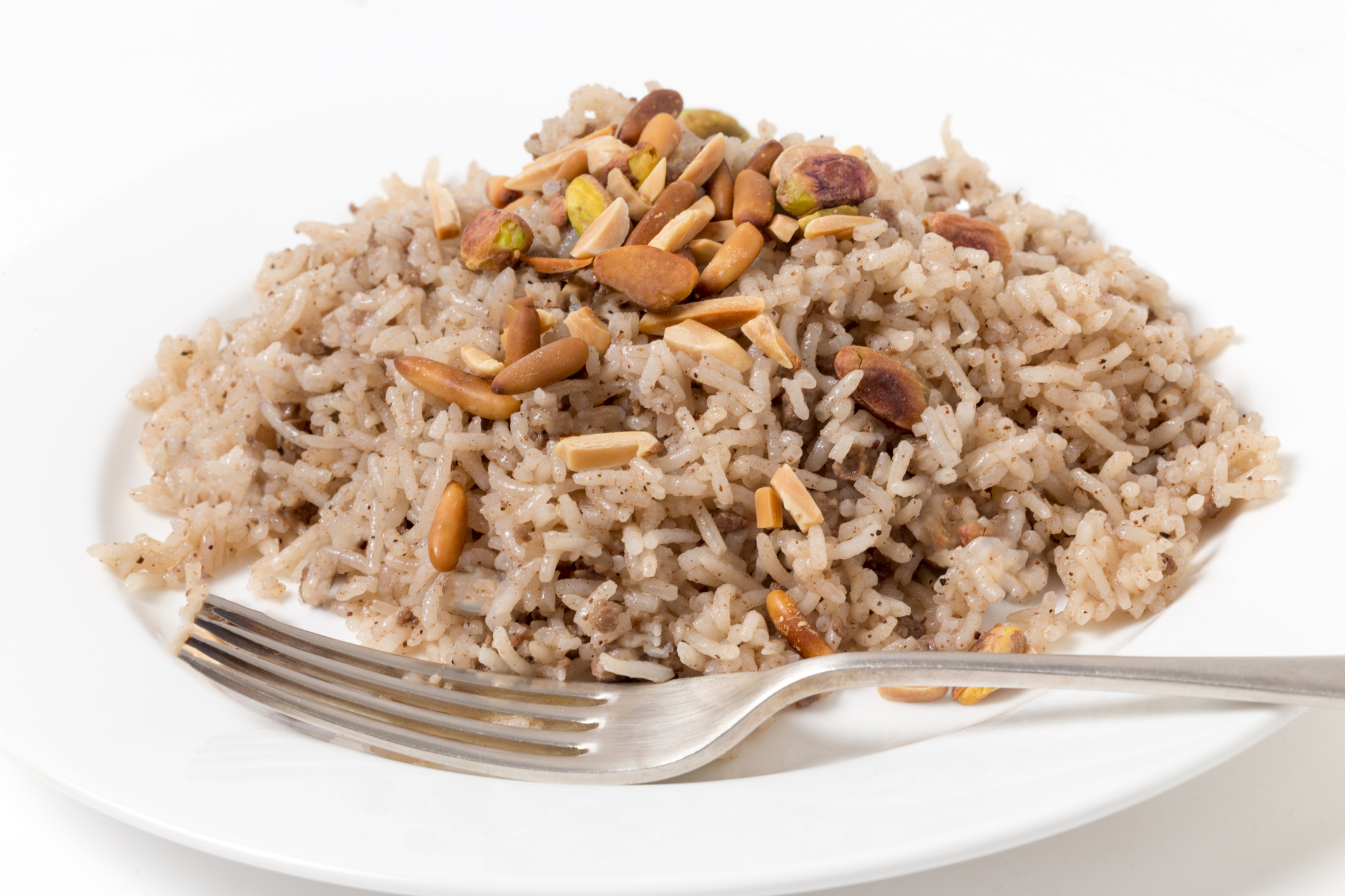 a plate of seasoned rice with almonds