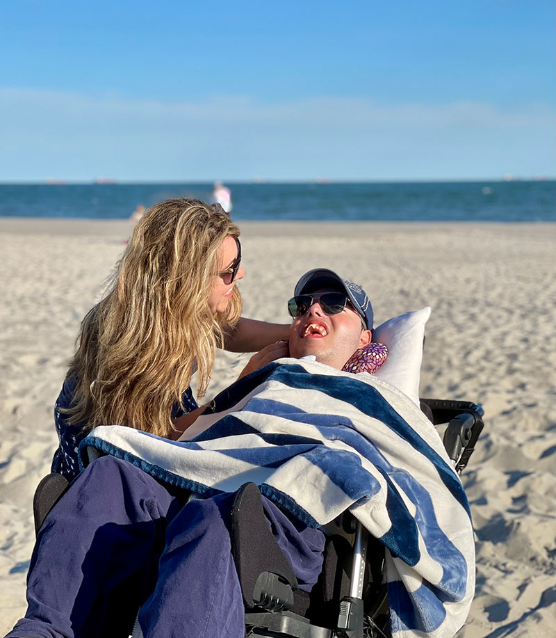 Jovan and his mother at the beach
