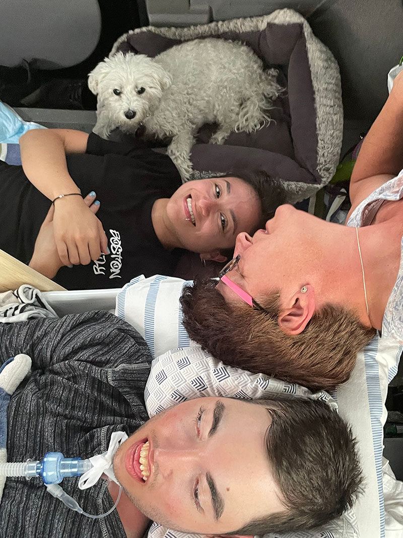 Jovan and his family having fun riding in the van