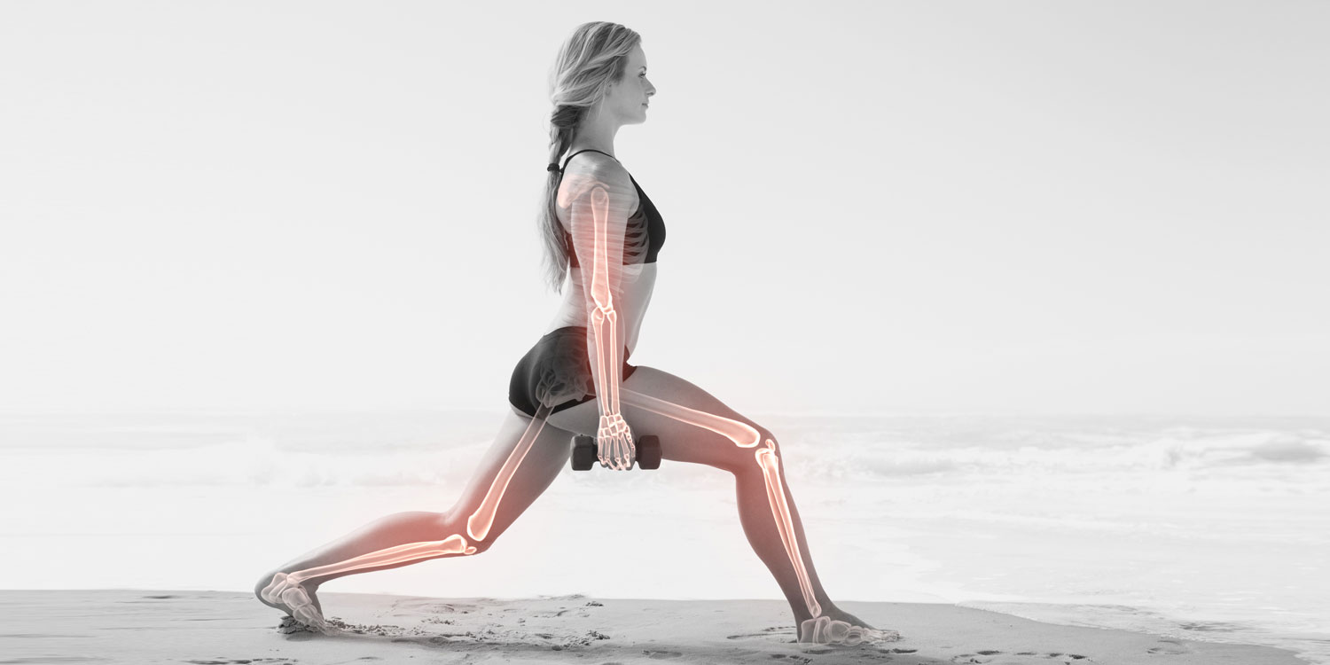 woman working out on the beach with highlighted bones
