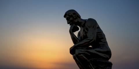 a statue of a man thinking