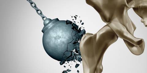 a wrecking ball shattering when it tries to break a hip