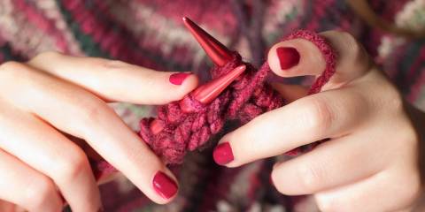 a young woman knitting as a hobby