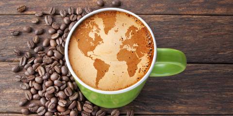 coffee beans, and a latte with the world drawn on it