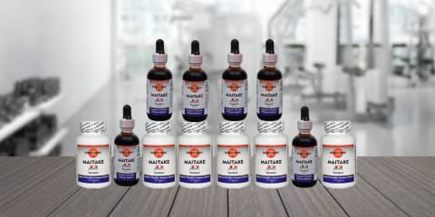 bottles of Mushroom Wisdom's Maitake D-Fraction in liquid and capsule form