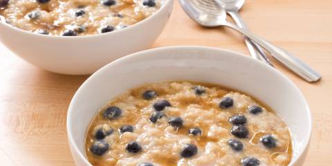 Delicious healthy bowls of ancient grain oatmeal with blueberries