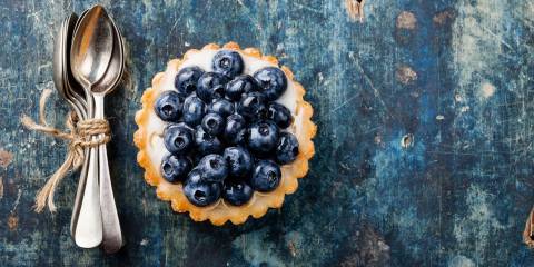 Blueberry tart and spoons