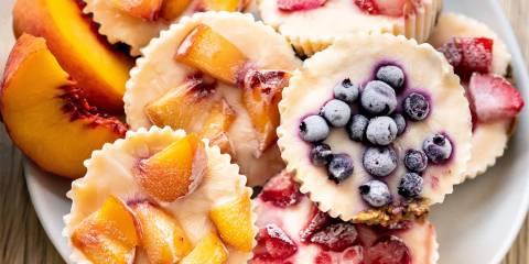 frozen yogurt in cupcake papers with fruit on top