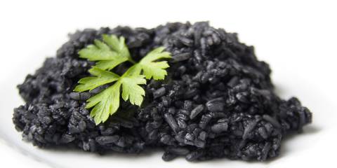 boiled black rice with herbs on top