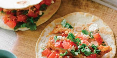 Buffalo Chicken Tacos prepared and ready to eat on a cutting board