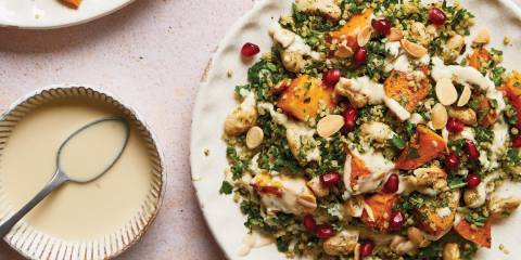 a plate of squash salad and a dish of tahini