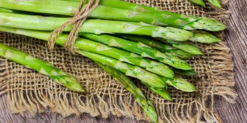 Bunch of green asparagus on burlap.