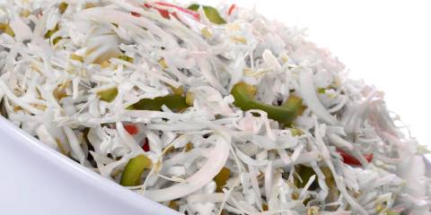 a bowl of shredded cabbage and bell peppers