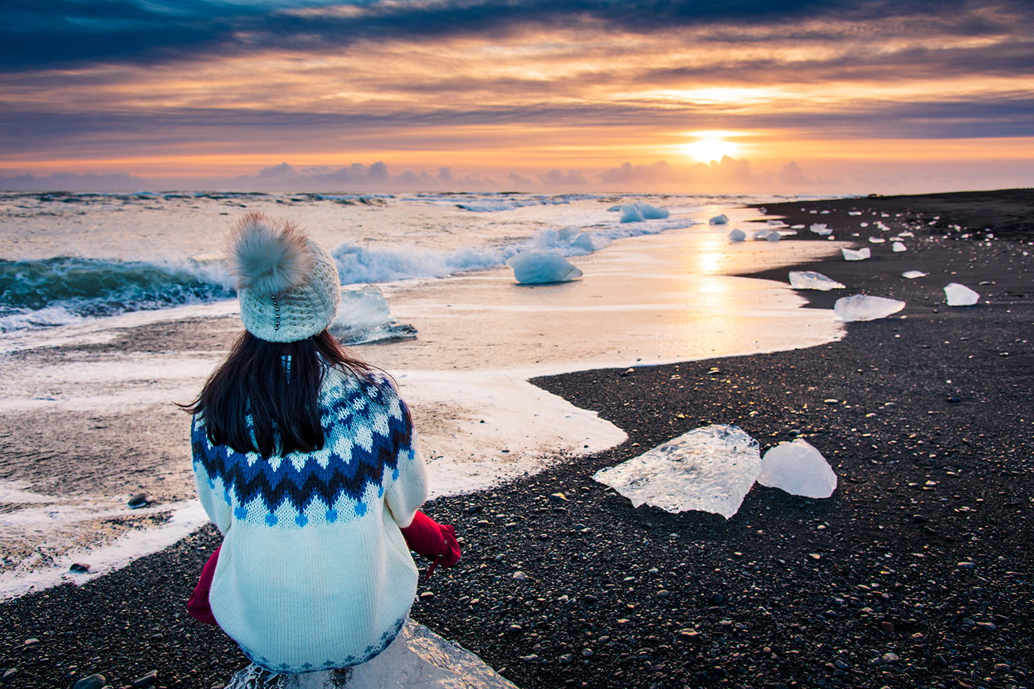 a healthy woman looking out at the cold sea