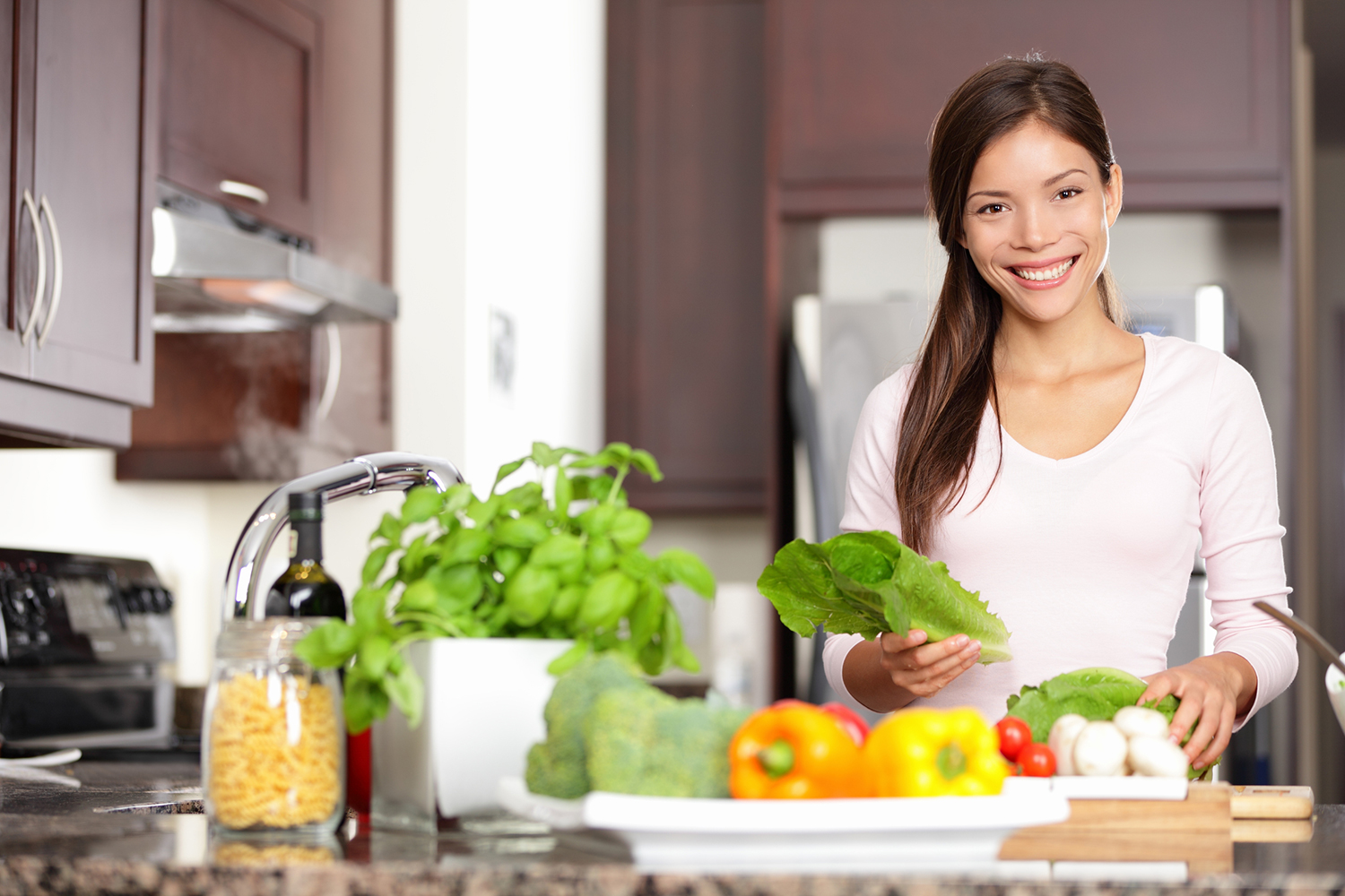 A woman with nutritious foods on her counter